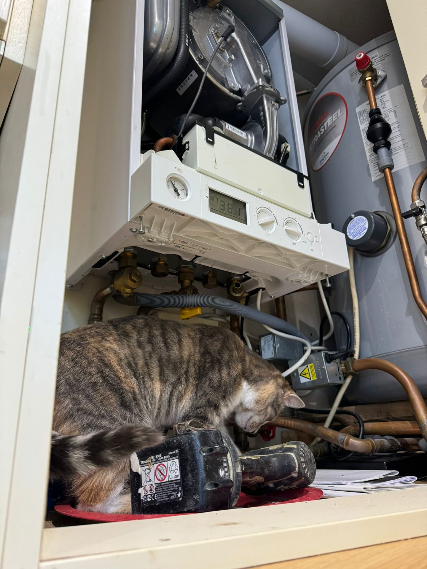 Close-up of a newly installed Ideal Classic² gas boiler with copper flow, return and gauge